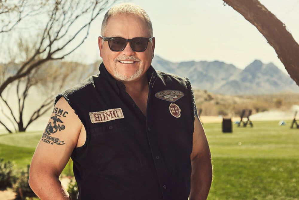 Bob Parsons on the golf course in a vest