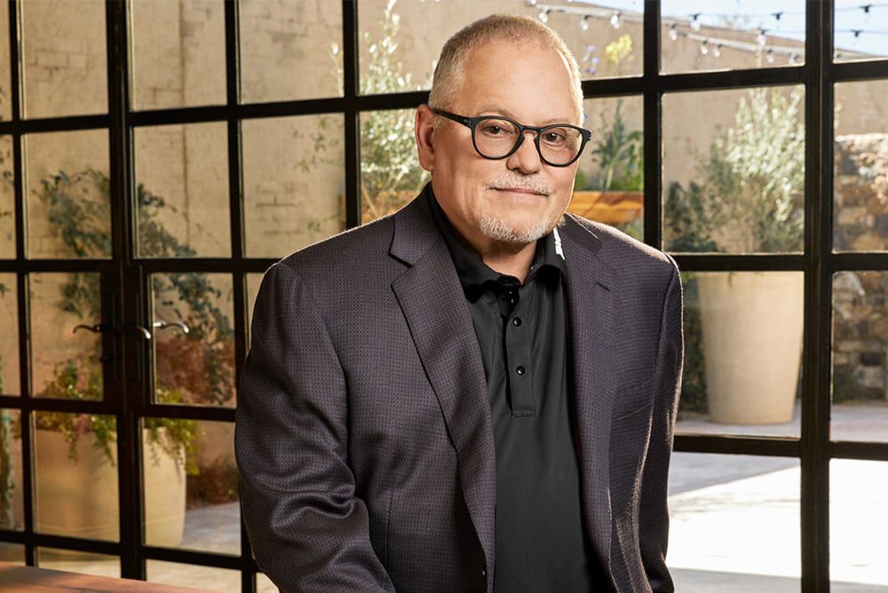 Bob Parsons Headshot wearing a blazer and glasses