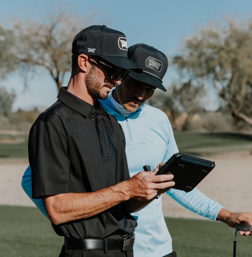 people talking over a golf shot